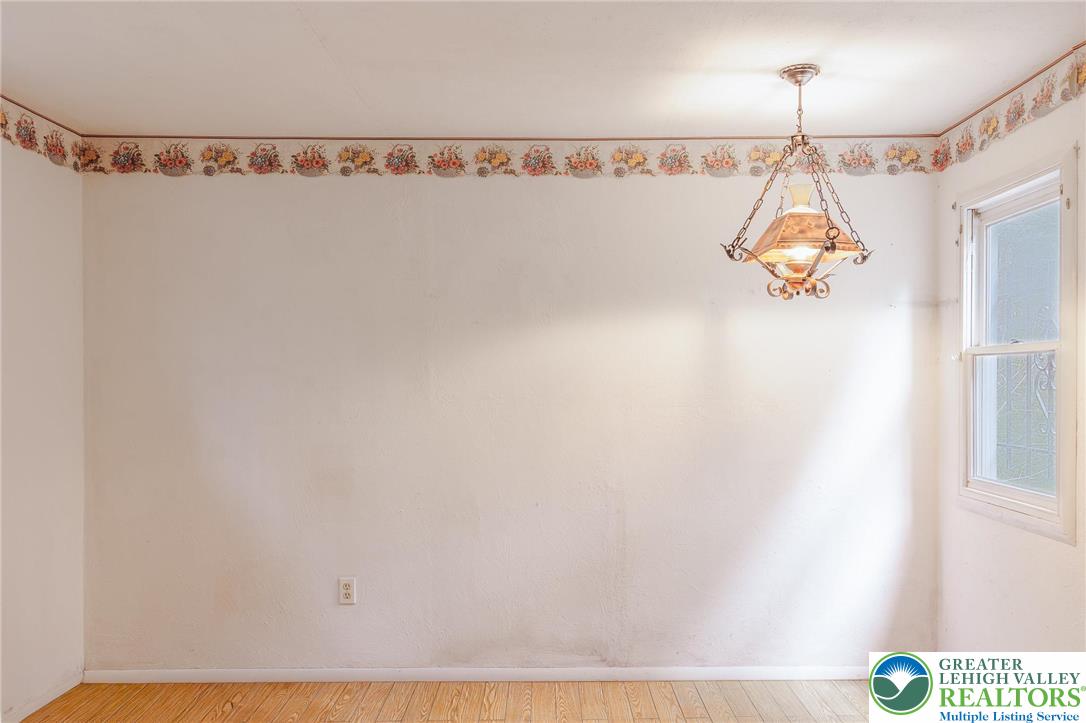 5211 Fir Lane Pocono Summit, PA 18346 - Photo 17 of 38 a picture of a room with a window and a chandelier