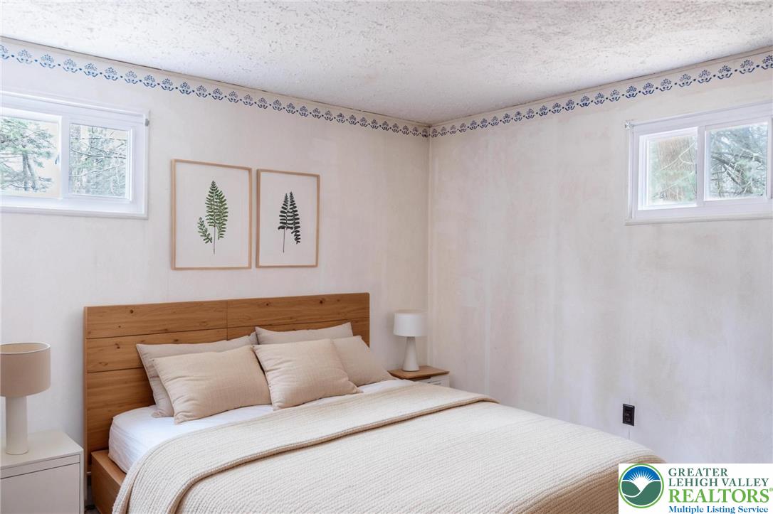 5211 Fir Lane Pocono Summit, PA 18346 - Photo 20 of 38 a bedroom with a bed and a window