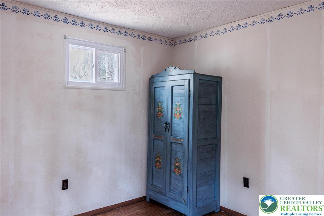 5211 Fir Lane Pocono Summit, PA 18346 - Photo 22 of 38 a view of hallway with wooden floor