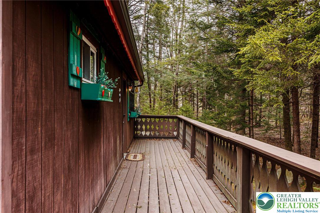 5211 Fir Lane Pocono Summit, PA 18346 - Photo 27 of 38 a view of balcony with wooden floor