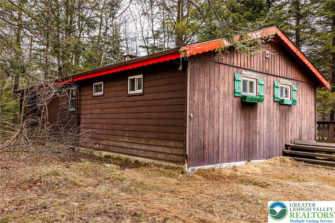 5211 Fir Lane Pocono Summit, PA 18346 - Photo 28 of 38 a view of a house with wooden fence