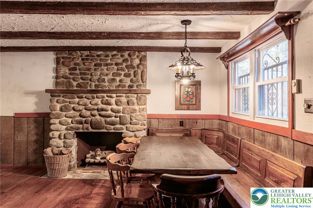 5211 Fir Lane Pocono Summit, PA 18346 - Photo 6 of 38 a dining room with a table and chairs