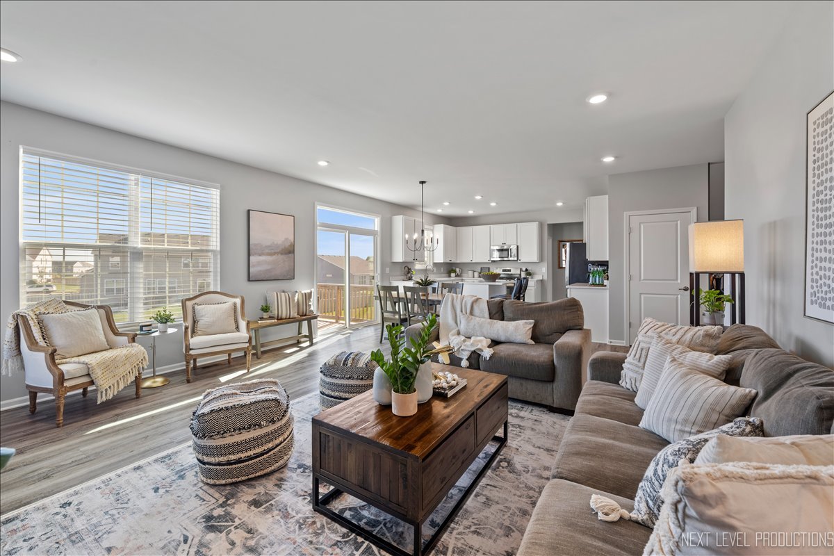 2236 Fairfax Way Yorkville, IL 60560 - Photo 12 of 28 a living room with furniture and a large window
