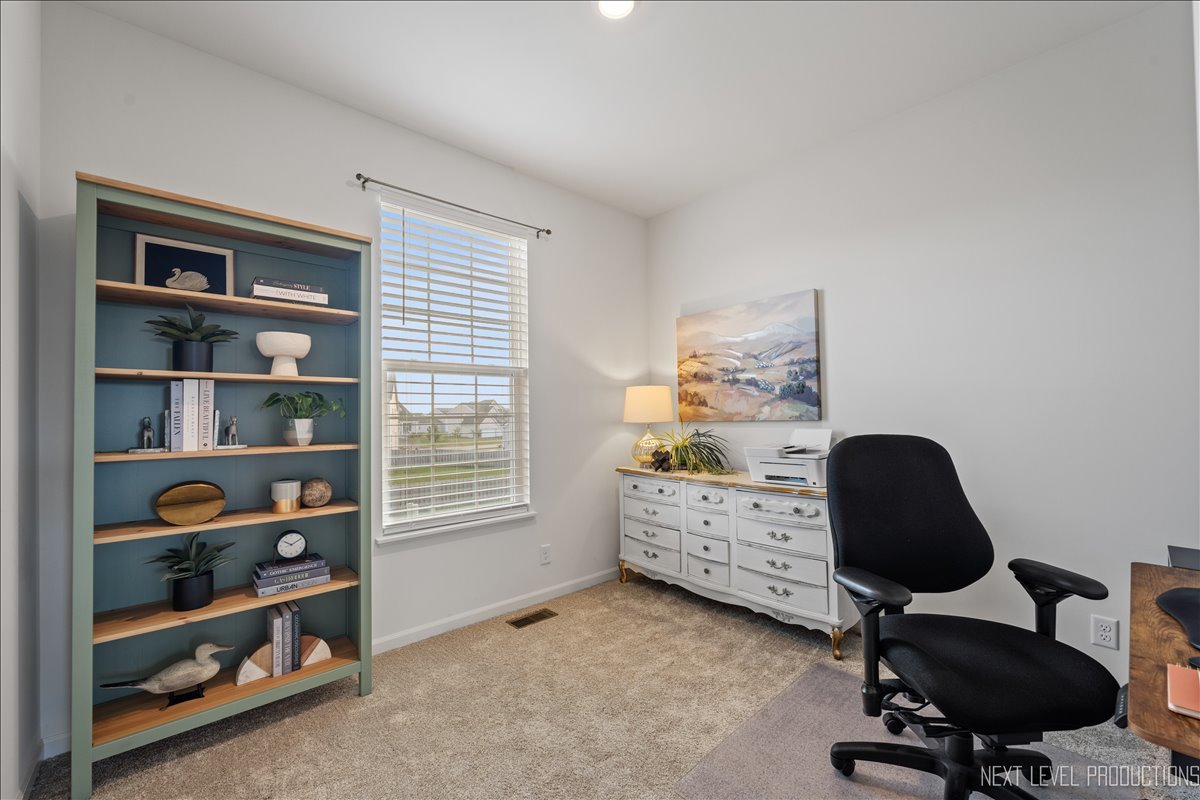 2236 Fairfax Way Yorkville, IL 60560 - Photo 14 of 28 a room with a chair and a window