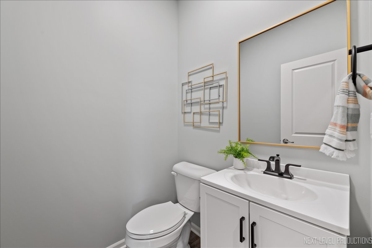 2236 Fairfax Way Yorkville, IL 60560 - Photo 15 of 28 a bathroom with a sink a toilet and a mirror