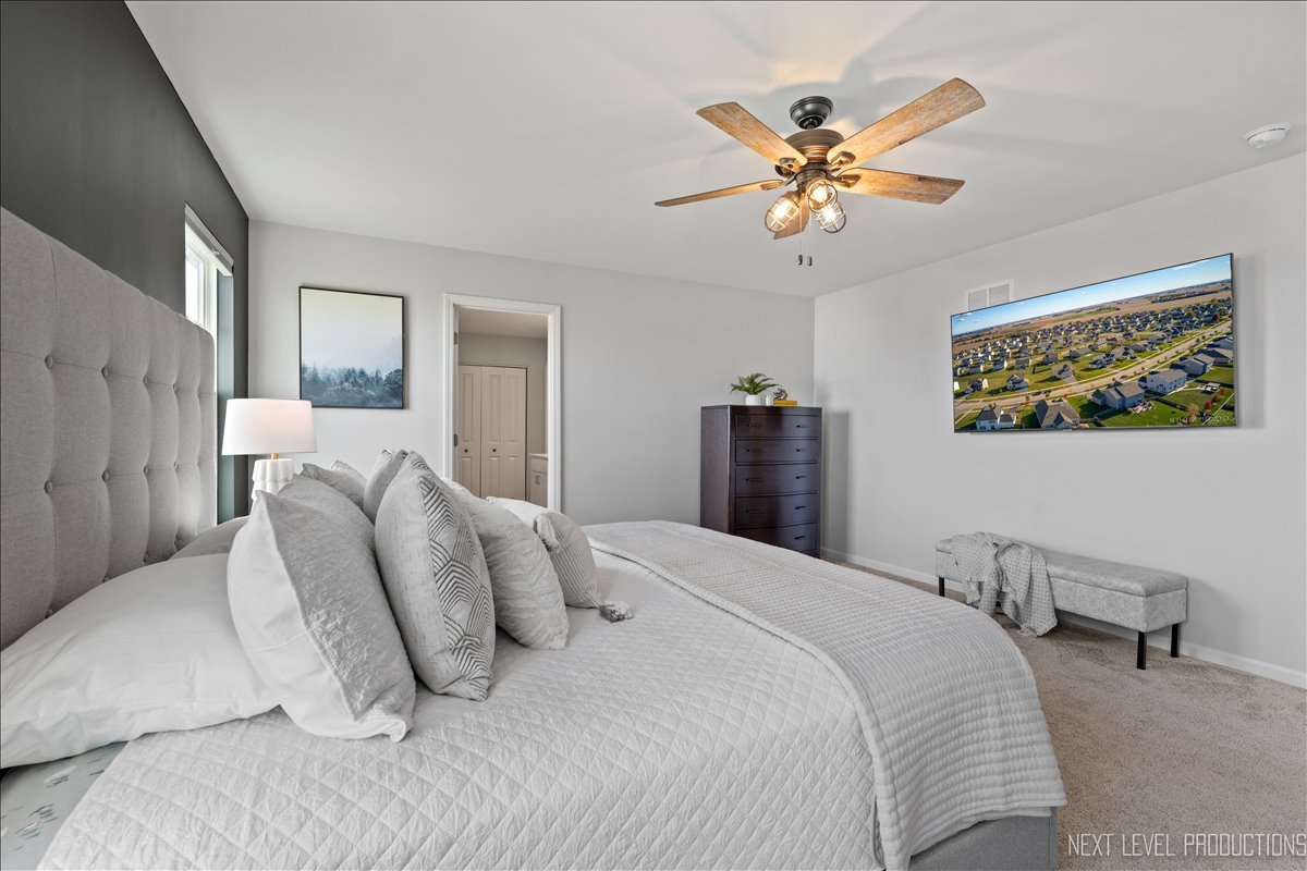 2236 Fairfax Way Yorkville, IL 60560 - Photo 18 of 28 a bedroom with a bed and window