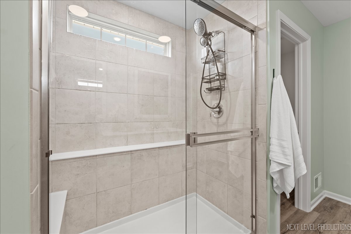 2236 Fairfax Way Yorkville, IL 60560 - Photo 20 of 28 a bathroom with a glass shower door
