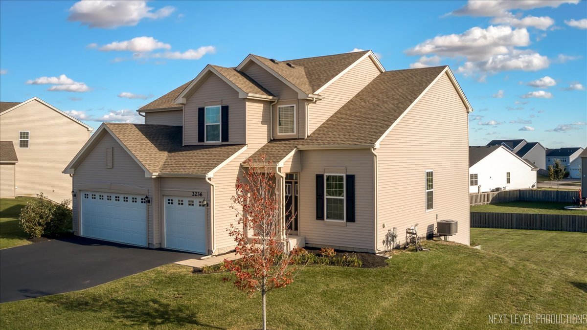 2236 Fairfax Way Yorkville, IL 60560 - Photo 2 of 28 a view of house with backyard