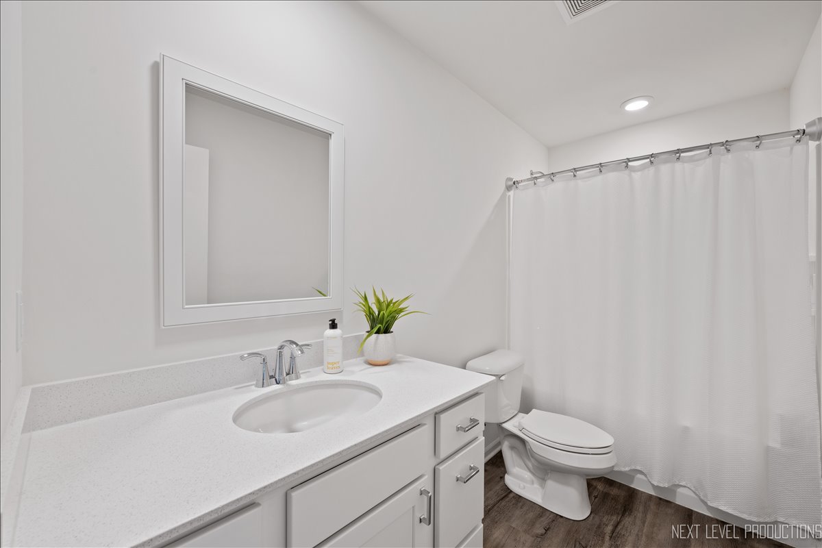 2236 Fairfax Way Yorkville, IL 60560 - Photo 22 of 28 a bathroom with a sink toilet and a mirror
