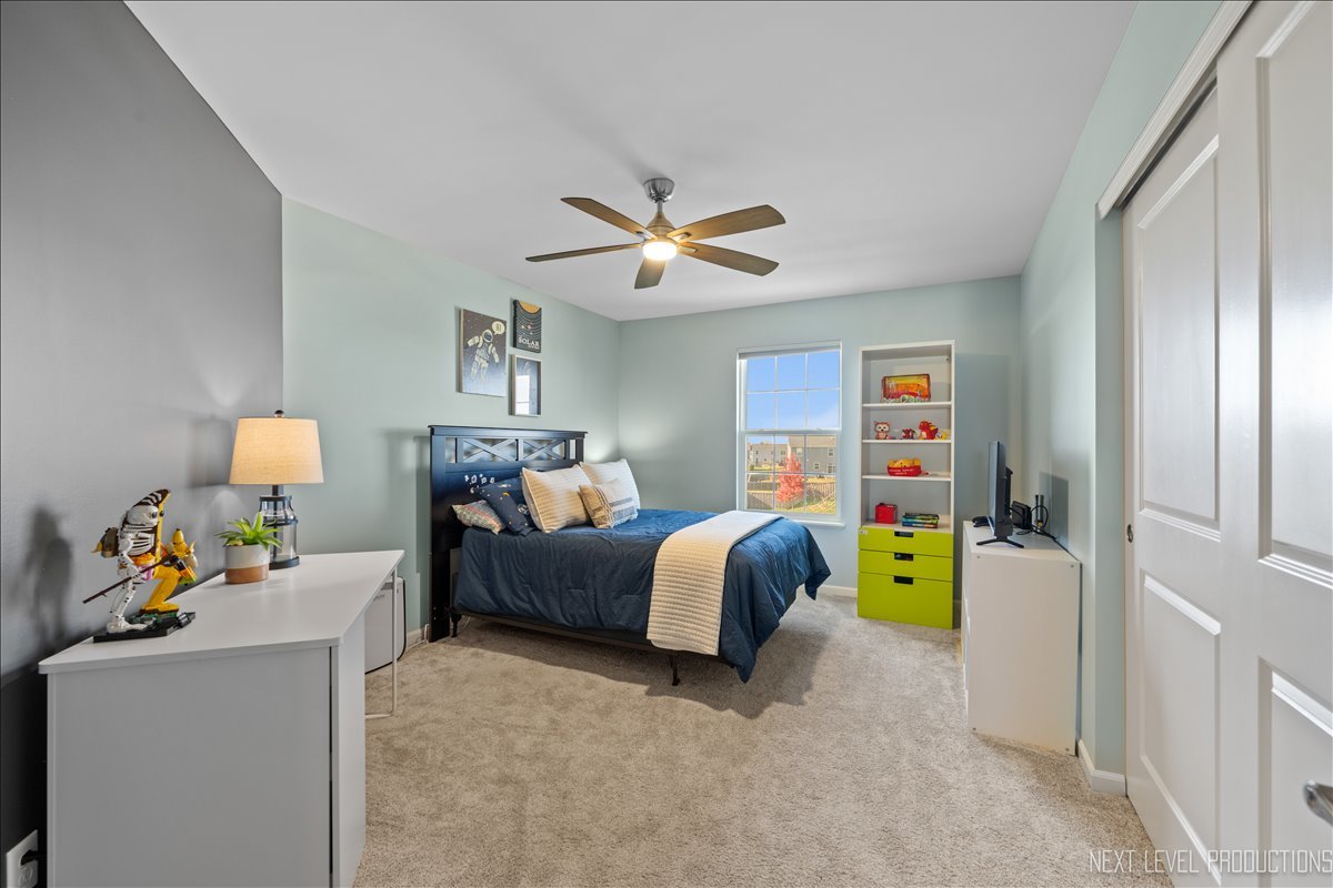 2236 Fairfax Way Yorkville, IL 60560 - Photo 23 of 28 a bed room with a bed and a workspace