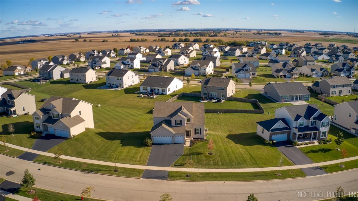 2236 Fairfax Way Yorkville, IL 60560 - Photo 26 of 28 an aerial view of a house with a garden and houses