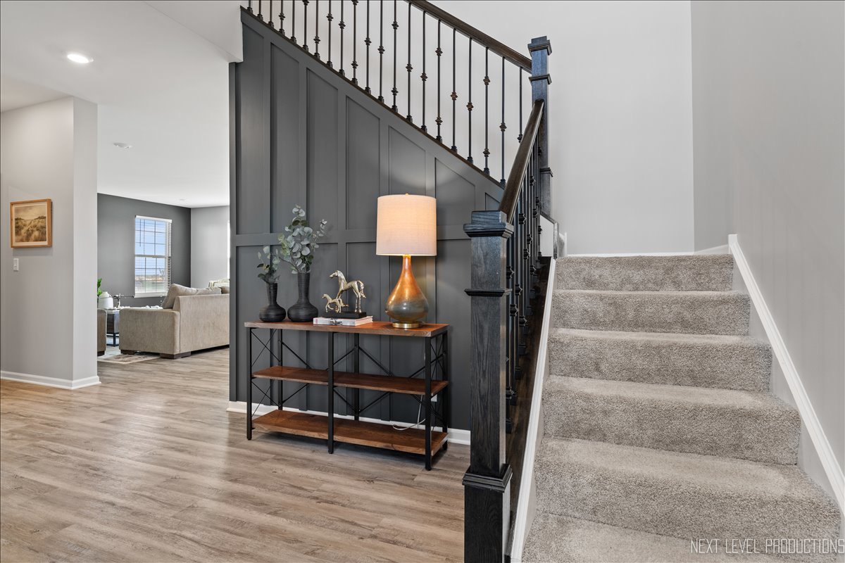 2236 Fairfax Way Yorkville, IL 60560 - Photo 3 of 28 a view of entryway dining room and hall with wooden floor