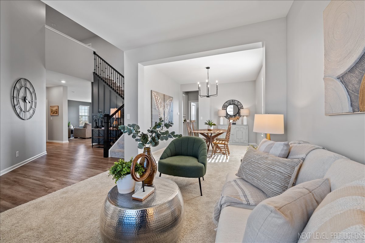 2236 Fairfax Way Yorkville, IL 60560 - Photo 5 of 28 a living room with furniture and a mirror