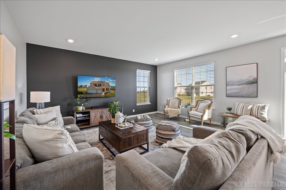 2236 Fairfax Way Yorkville, IL 60560 - Photo 10 of 28 a living room with furniture and a flat screen tv