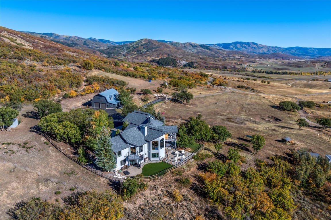 an aerial view of residential house and sandy dunes
