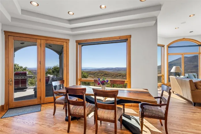 a view of a dining room with furniture window and wooden floor