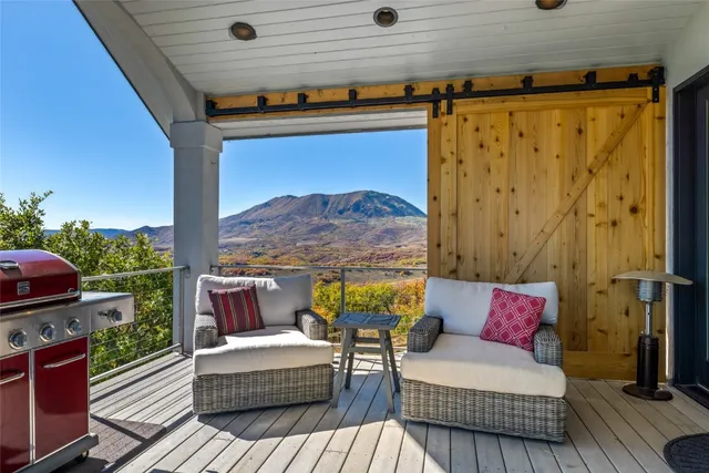 a outdoor living space with furniture and a fireplace
