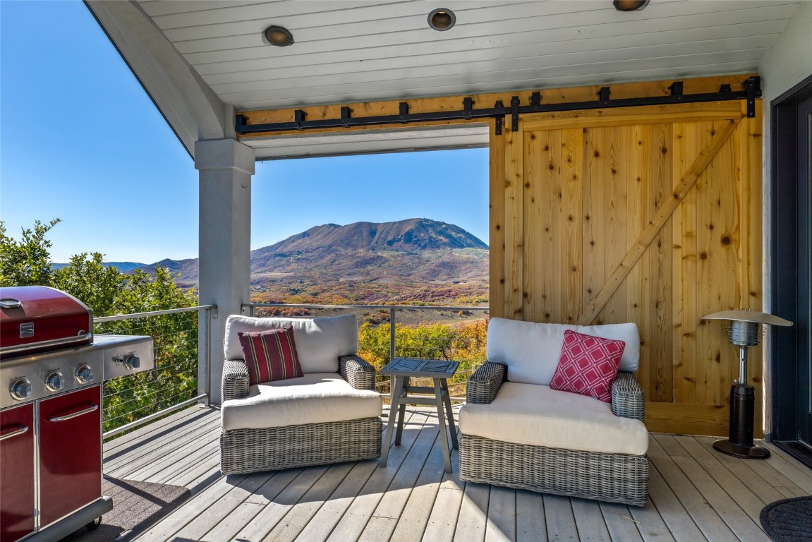 44300 Diamondback Way Steamboat Springs, CO 80487 - Photo 16 of 49 a outdoor living space with furniture and a fireplace