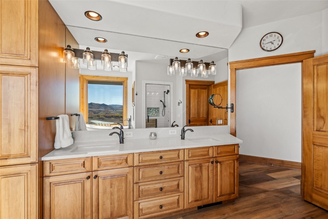 44300 Diamondback Way Steamboat Springs, CO 80487 - Photo 22 of 49 a bathroom with a double vanity sink and a mirror
