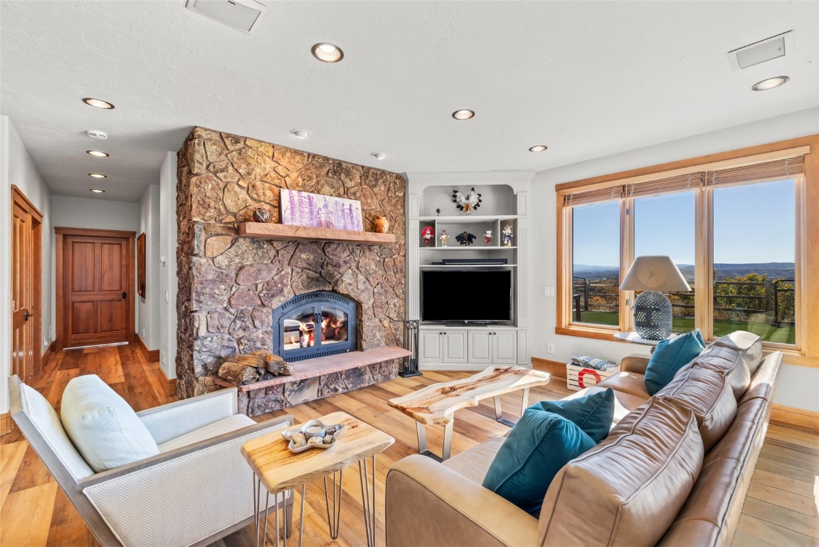 44300 Diamondback Way Steamboat Springs, CO 80487 - Photo 28 of 49 a living room with furniture and a fireplace