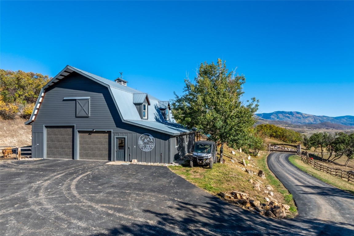 44300 Diamondback Way Steamboat Springs, CO 80487 - Photo 41 of 49 a front view of a house with a yard