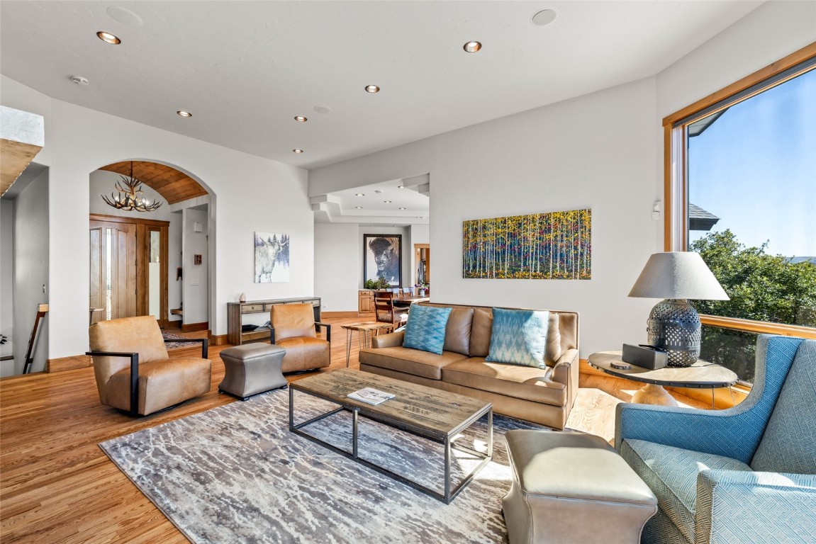 44300 Diamondback Way Steamboat Springs, CO 80487 - Photo 10 of 49 a living room with furniture wooden floor and a table