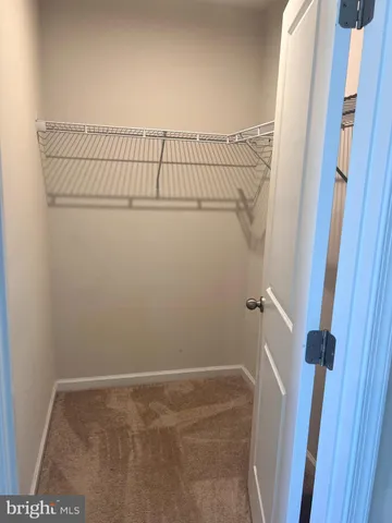 a view of a room with racks on the wall