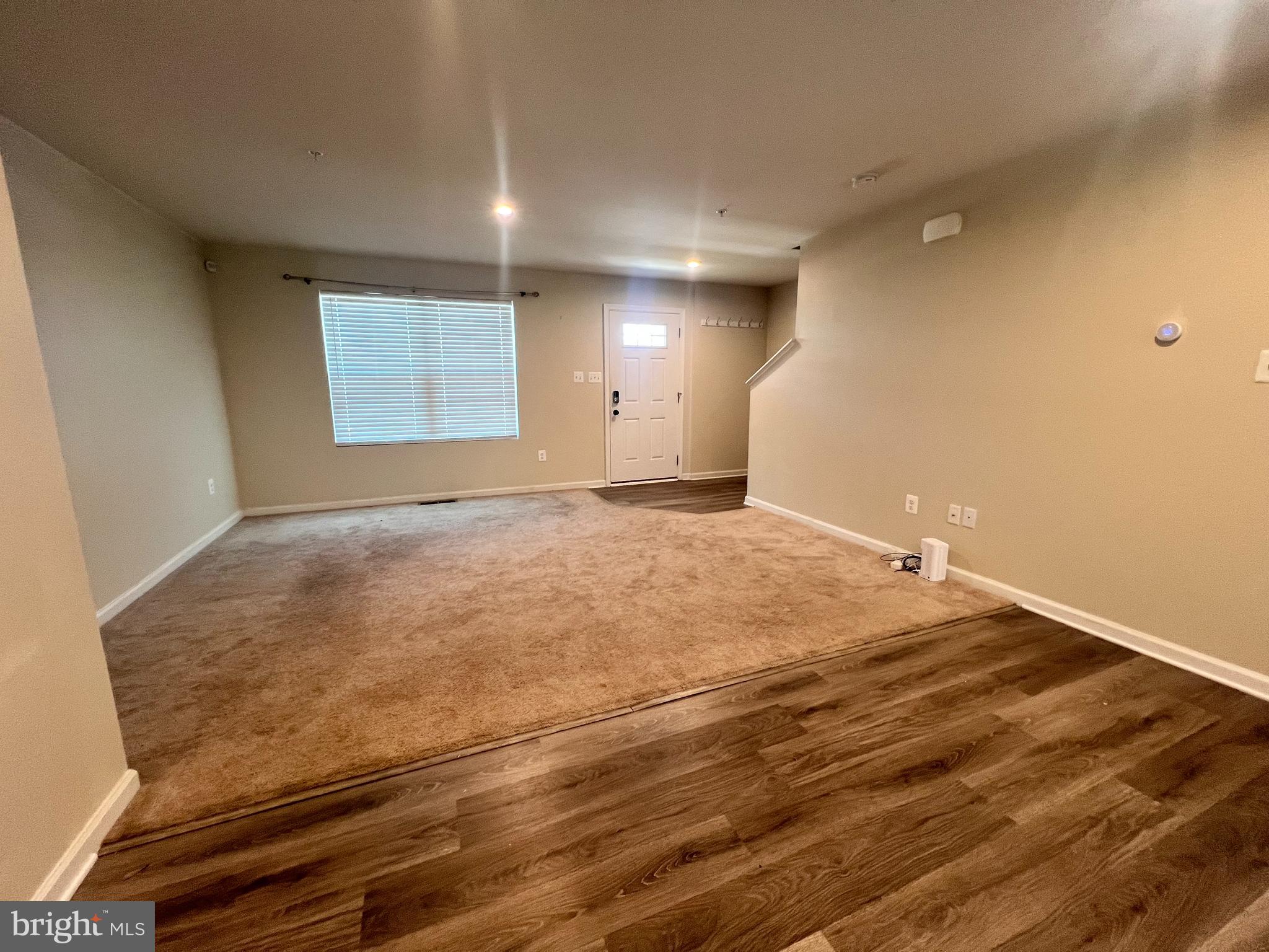 122 Butterfield Avenue Taneytown, MD 21787 - Photo 3 of 19 a view of empty room with wooden floor
