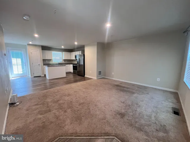 a view of kitchen and kitchen with window
