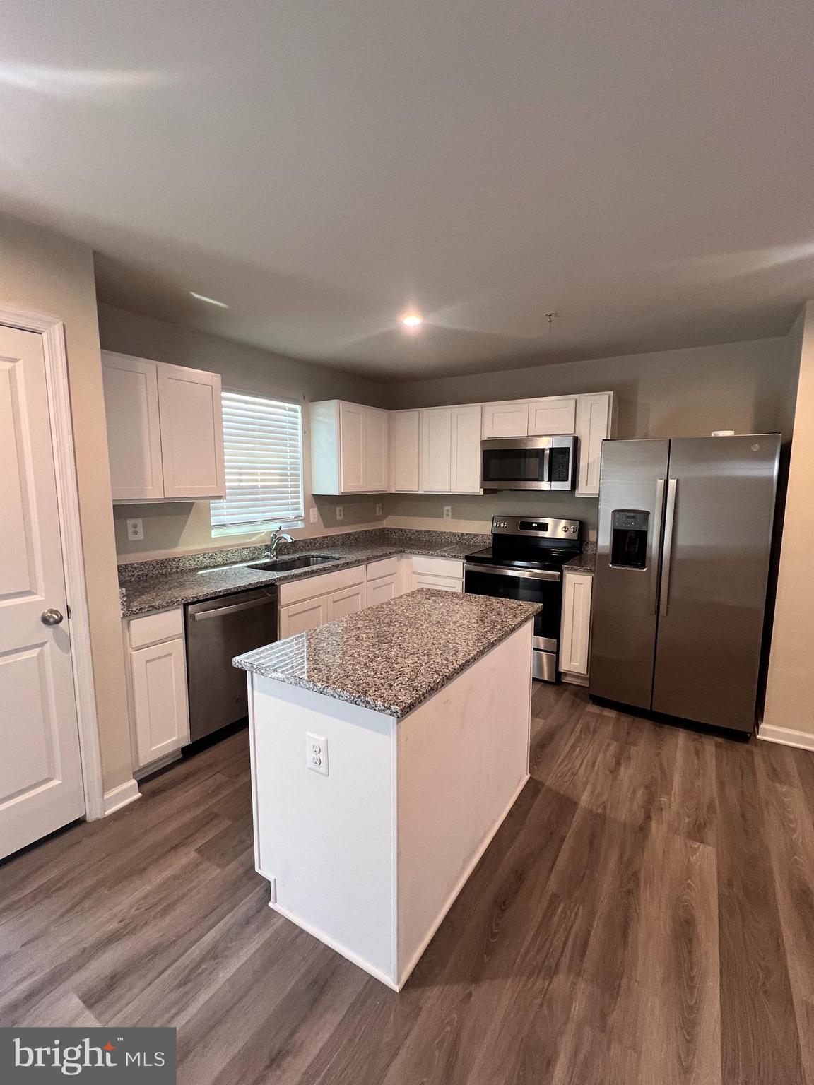 122 Butterfield Avenue Taneytown, MD 21787 - Photo 7 of 19 a large kitchen with stainless steel appliances granite countertop a stove a sink and a refrigerator