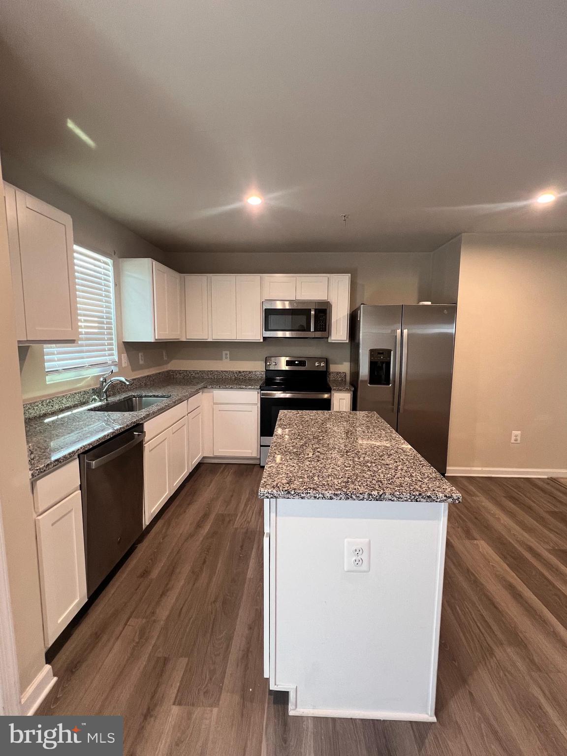 122 Butterfield Avenue Taneytown, MD 21787 - Photo 8 of 19 a kitchen with stainless steel appliances granite countertop a stove a sink dishwasher and a refrigerator