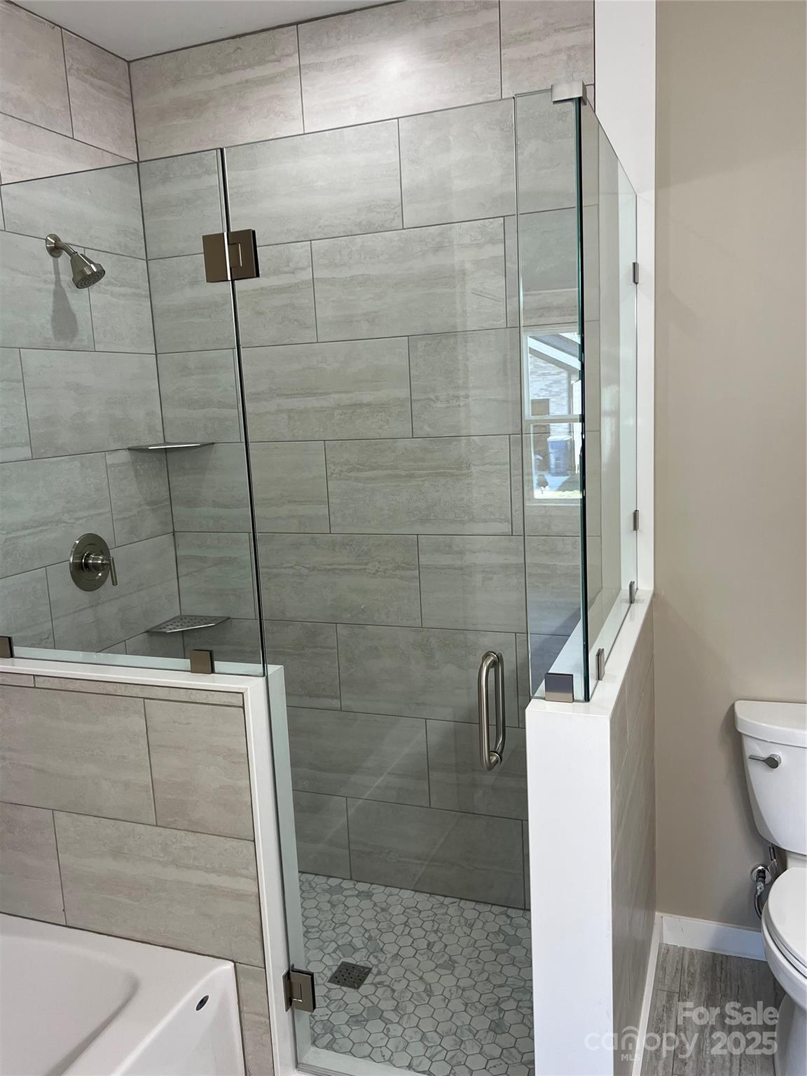 130 Peyton Elaine Road Clyde, NC 28721 - Photo 10 of 12 a bathroom with a shower and toilet