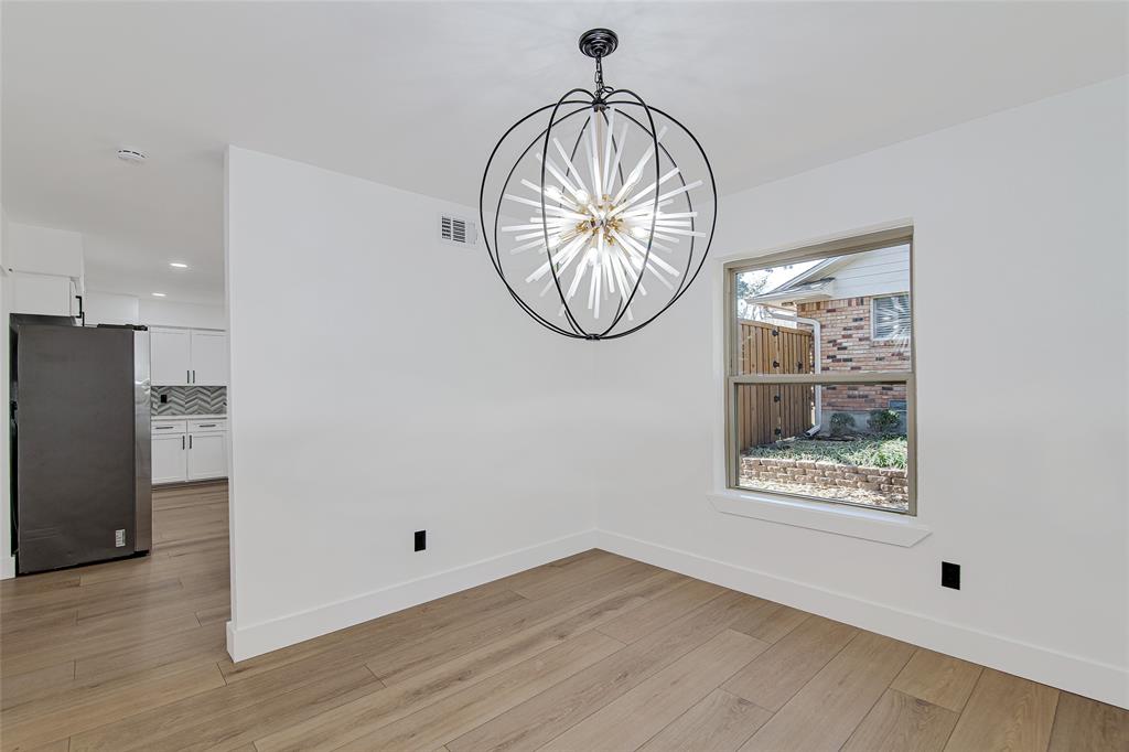 7992 Fallmeadow Lane Dallas, TX 75248 - Photo 11 of 30 a view of wooden floor with a window in a room