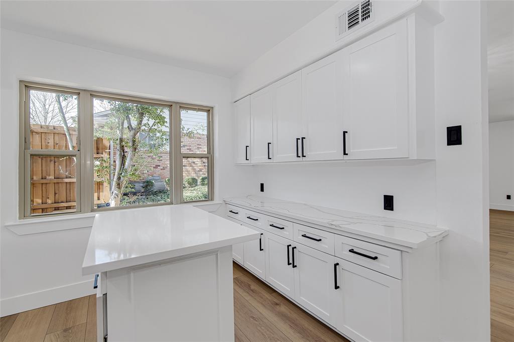 7992 Fallmeadow Lane Dallas, TX 75248 - Photo 15 of 30 a kitchen with a sink and a window