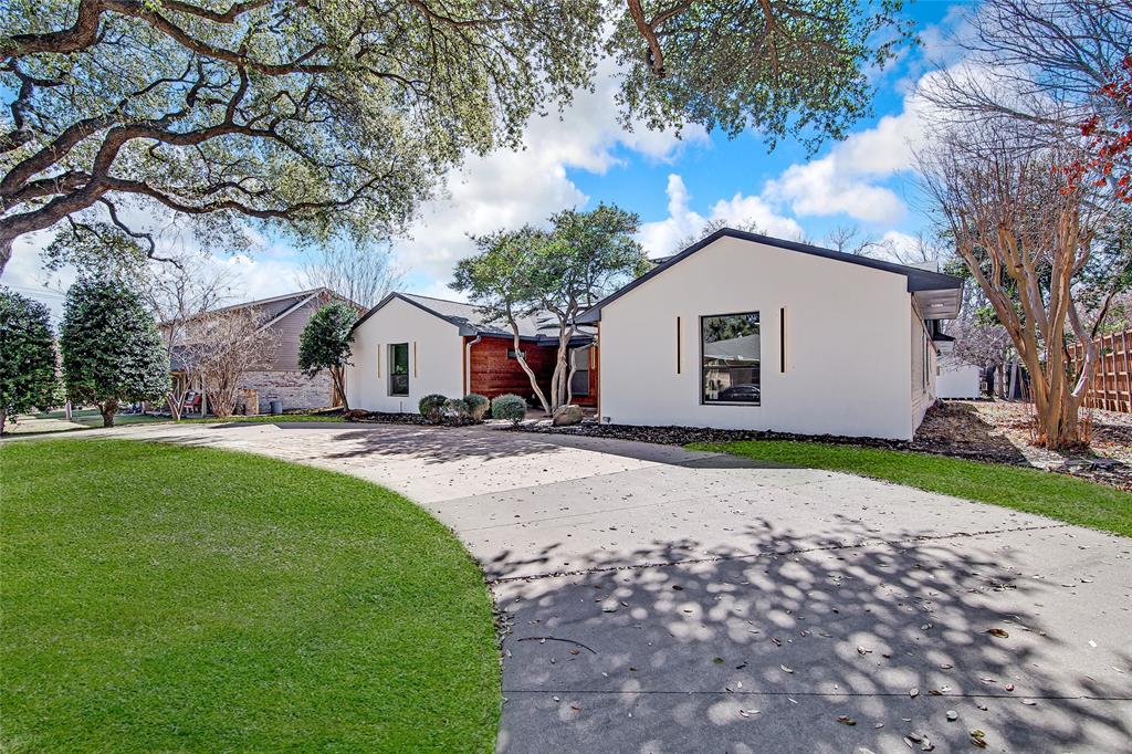 7992 Fallmeadow Lane Dallas, TX 75248 - Photo 2 of 30 a house view with a garden space
