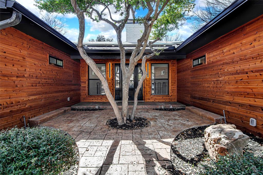 7992 Fallmeadow Lane Dallas, TX 75248 - Photo 4 of 30 a front view of a house