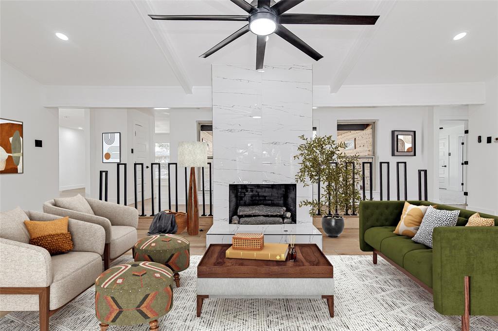 7992 Fallmeadow Lane Dallas, TX 75248 - Photo 6 of 30 a living room with furniture and a fireplace