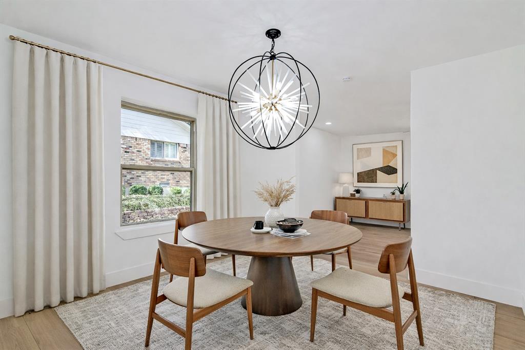 7992 Fallmeadow Lane Dallas, TX 75248 - Photo 10 of 30 a table and chairs in a room