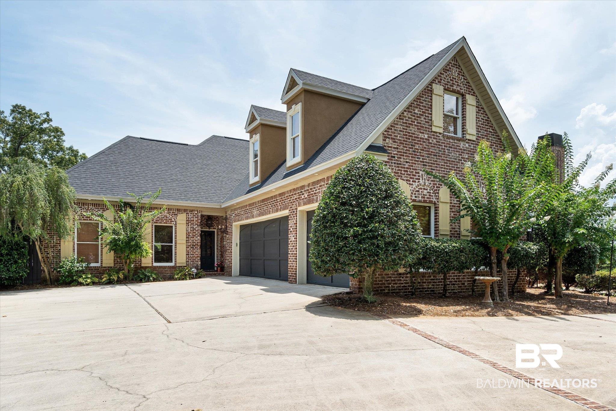 2905 Riverview Pointe Drive South Theodore, AL 36582 - Photo 29 of 44 View of front of house featuring brick siding, concrete driveway, a shingled roof, and a garage