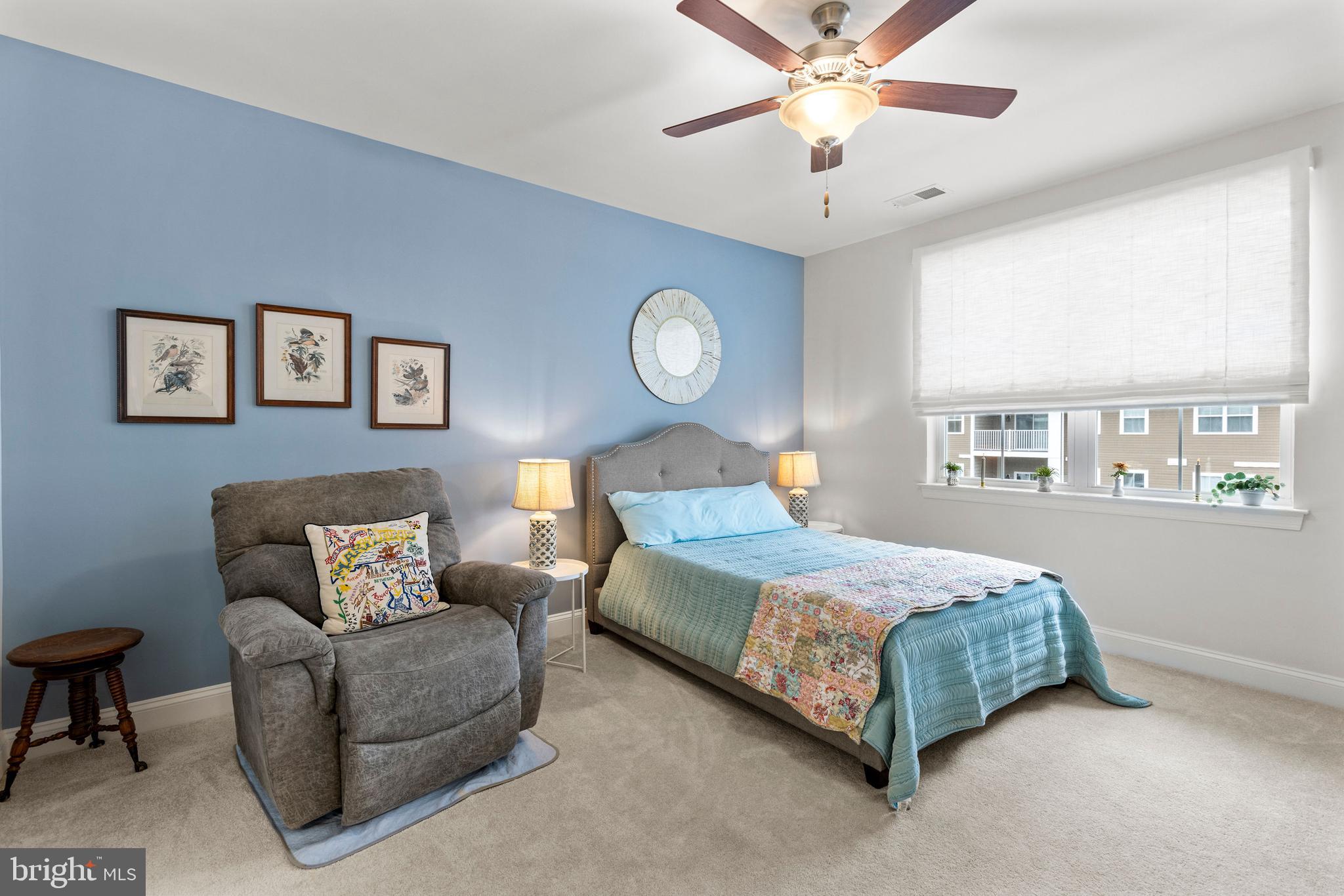 403 Bold Ruler Court, Unit 405 Havre de Grace, MD 21078 - Photo 13 of 32 a bedroom with a bed couch and a window