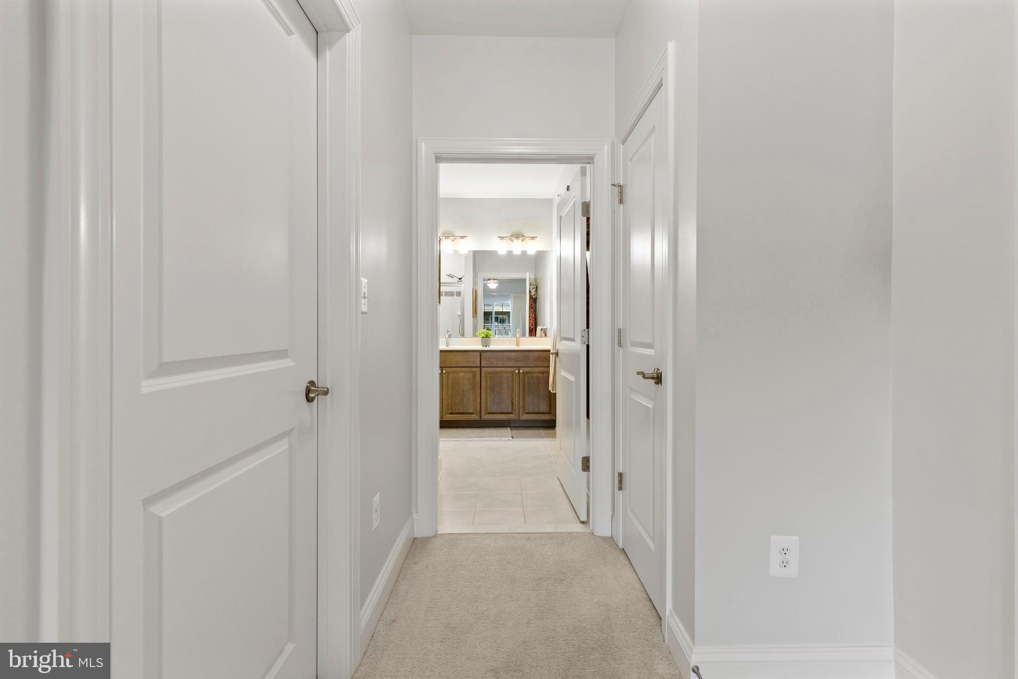 403 Bold Ruler Court, Unit 405 Havre de Grace, MD 21078 - Photo 19 of 32 a view of a hallway with wooden floor and kitchen