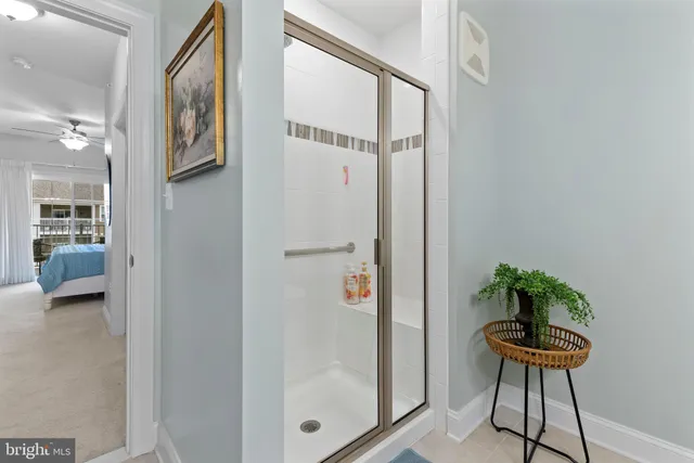 a view of a hallway and a livingroom with furniture