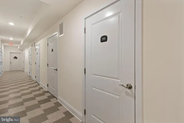 a front view of a building with parking space