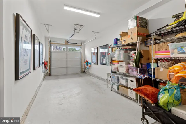 a front view of a building with cars parked