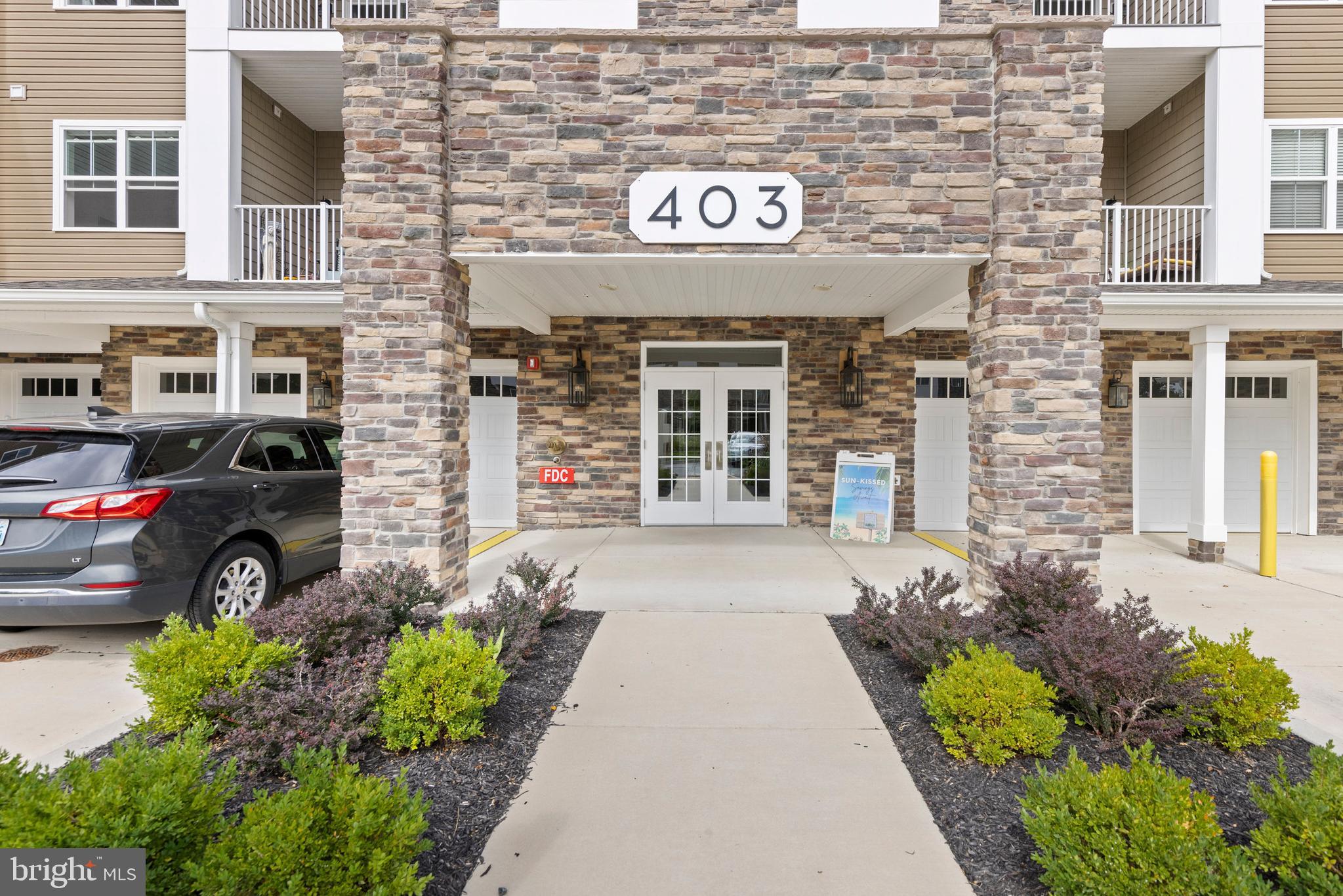 403 Bold Ruler Court, Unit 405 Havre de Grace, MD 21078 - Photo 30 of 32 a front view of a building with parking space