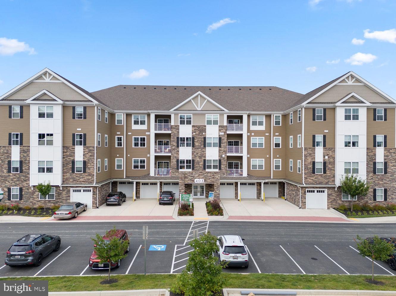403 Bold Ruler Court, Unit 405 Havre de Grace, MD 21078 - Photo 31 of 32 a front view of a building with cars parked