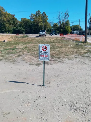 a view of a street with trees in the background