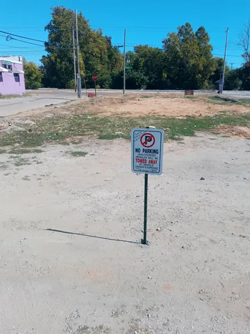 a view of a street with trees