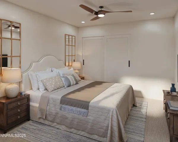 a bedroom with bed and a chandelier