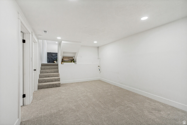 62 South Clark Lane Elk Ridge, UT 84651 - Photo 24 of 30 Spacious family/flex room #2 featuring neutral carpet flooring, recessed lighting, and crisp white walls